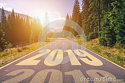 Empty asphalt road and New year 2019 concept. Driving on an empty road in the mountains to upcoming 2019 and leaving behind old 2 Stock Photo