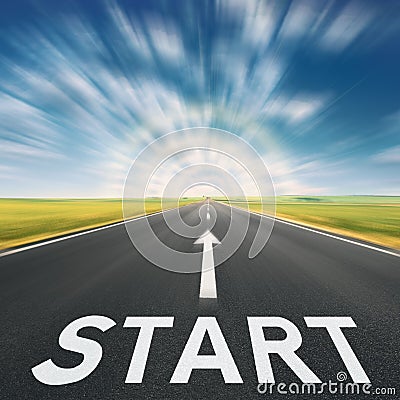 Empty asphalt road with a sign start in blurred motion Stock Photo