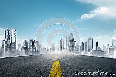 Empty asphalt road towards modern city Stock Photo