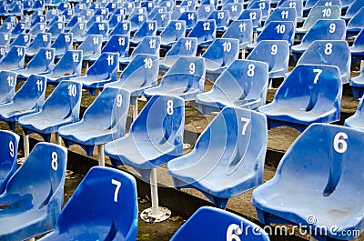 Empty auditorium with blue numbered chairs Stock Photo