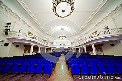 Empty auditorium with rows of chairs. Stock Photo