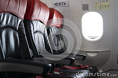 Empty available seat on the aircraft near the exit Stock Photo