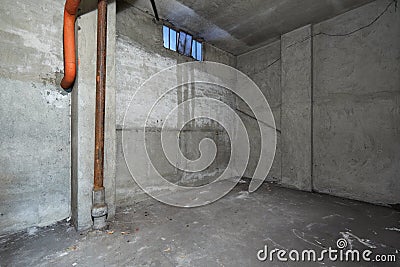 Empty basement interior with concrete walls Stock Photo