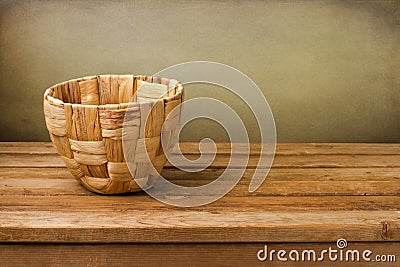 Empty basket on wooden deck table Stock Photo