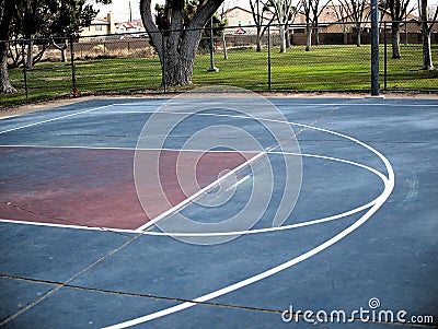 Empty basketball court lines painted on cement ground. Stock Photo