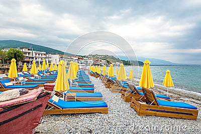 Empty beach chairs and umbrellas. Platamonas, Pieria, Greece Stock Photo