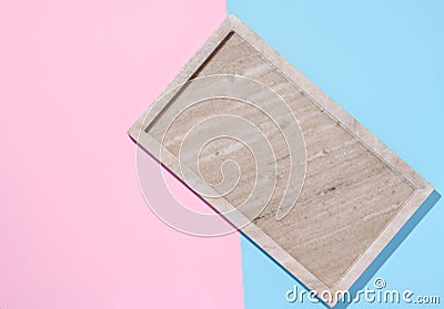 Empty beige rectangular marble plate on a blue pink background Stock Photo