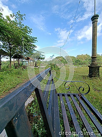 Empty bench in abandoned park Editorial Stock Photo