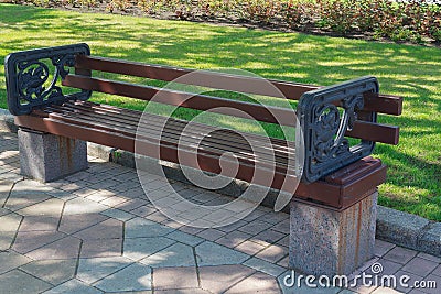 Empty bench in the alley in the park Stock Photo