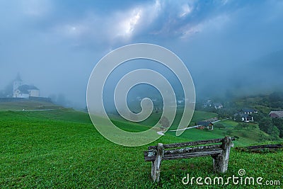 Empty bench overlooking Sorica village in Slovenia Stock Photo