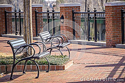 Empty benches in a city park in spring Stock Photo