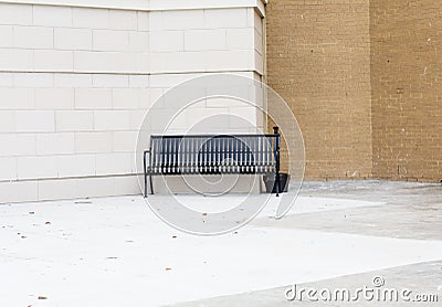 Empty Black Bench Outside Building for Smokers Stock Photo