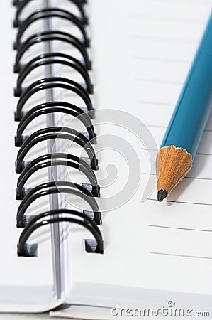 Empty blank ring, spiral notepad, blue pencil Stock Photo
