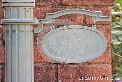 Empty blank steel signboard for any title or name with brick wall background Stock Photo