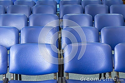 Empty blue chairs at a conference room. Stock Photo