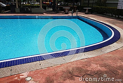 Empty Blue Mosaic swimming pool with ripples Stock Photo