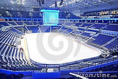 Empty blue seats at hockey rink Stock Photo
