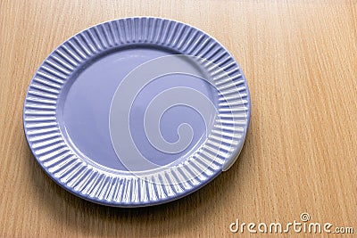 An empty bluish-gray plate on the table Stock Photo