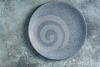 Empty bluish plate on concrete Stock Photo
