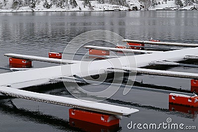 Empty boat moorings on lake Stock Photo