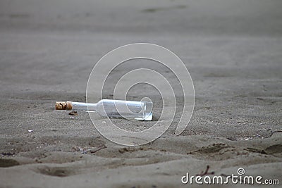 Empty bottle on a shore Stock Photo