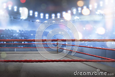 Empty boxing ring with red ropes for match Stock Photo