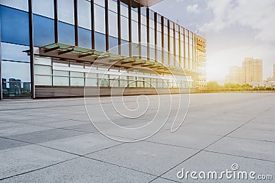 Empty brick floor with modern building in background Stock Photo