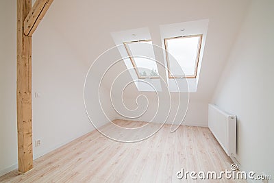 Empty bright attic room. Stock Photo