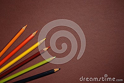 Empty brown cardboard and coloured pencils Stock Photo