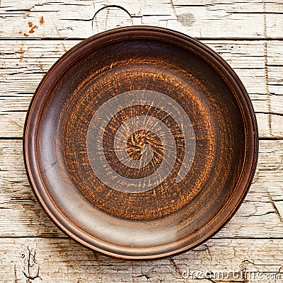 Empty brown ceramic plate Stock Photo