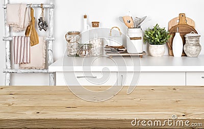 Empty brown wooden table with blurred image of kitchen interior Stock Photo