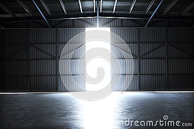 Empty building hangar with the door open with room for text or copy space. Stock Photo