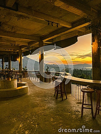 Empty cafe on sunrise with view on Batur volcano Stock Photo