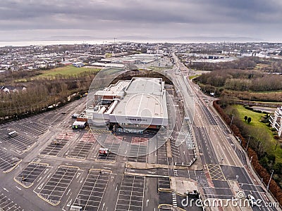 Empty car park by a shopping center. Editorial Stock Photo