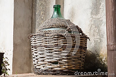 Empty carboy in rustic house Stock Photo