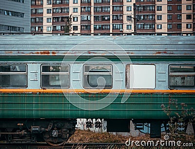 An empty carriage on the railway. Retro green steam train. Stock Photo