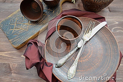 Empty ceramic dishware and wooden objets flat view Stock Photo