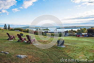 Empty chair facing a majestic scenery on a clear autumn morning Stock Photo