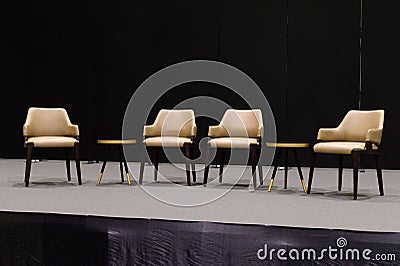 Empty chairs on stage ready for seminar Stock Photo