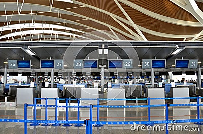 Empty check in counters at Shanghai Pudong International Airport China Editorial Stock Photo
