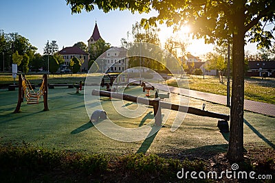 Empty child playground in the town or village during sunrise Stock Photo