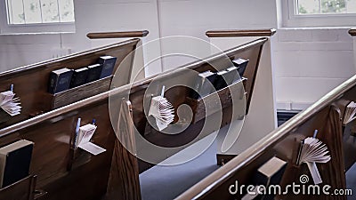 Church pews with Bibles Stock Photo