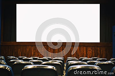 Empty cinema auditorium with empty white screen. Empty rows of theater or movie seats Stock Photo