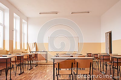 Empty classroom with wooden desks Stock Photo