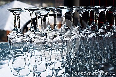 Empty clean glasses for wine and other drinks in bar Stock Photo