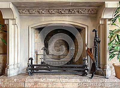 Empty and clean stately Victorian fireplace ready for the cold of winter Stock Photo