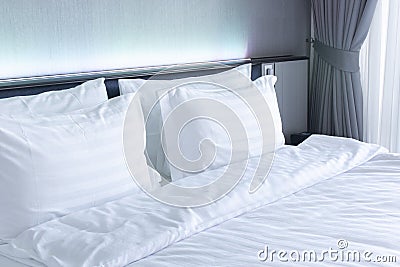 Empty clear bedroom with white bed and pillows Stock Photo