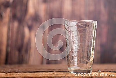 Empty clear glass of water on the wooden table Cartoon Illustration