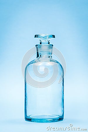 Empty clear reagent bottle with glass stopper Stock Photo