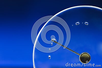 Empty clock lid with drop Stock Photo